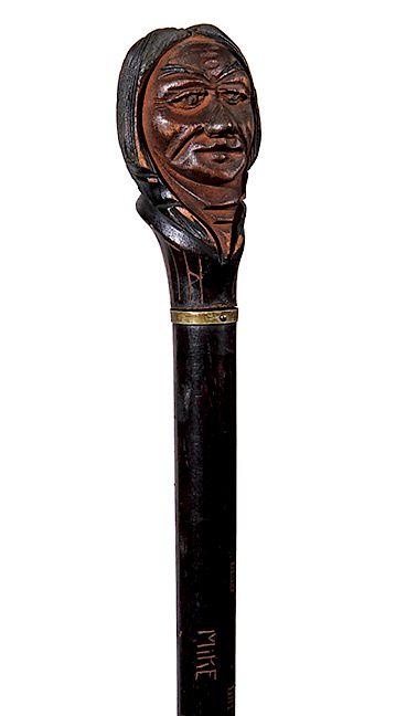 Appraisal: Dartmouth Indian Cane A Dartmouth Indian head cane ebonized shaft