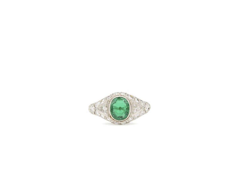 Appraisal: Platinum Emerald and Diamond Ring centering a bezel-set oval-cut emerald