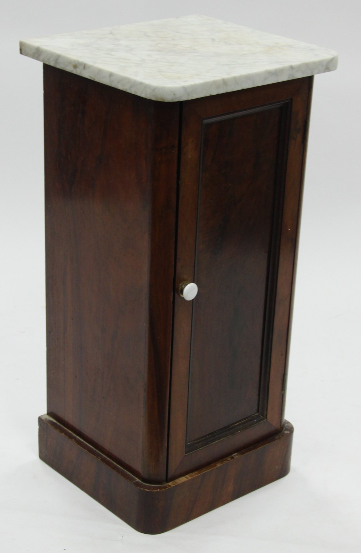 Appraisal: A late th Century marble top pedestal cupboard enclosed by