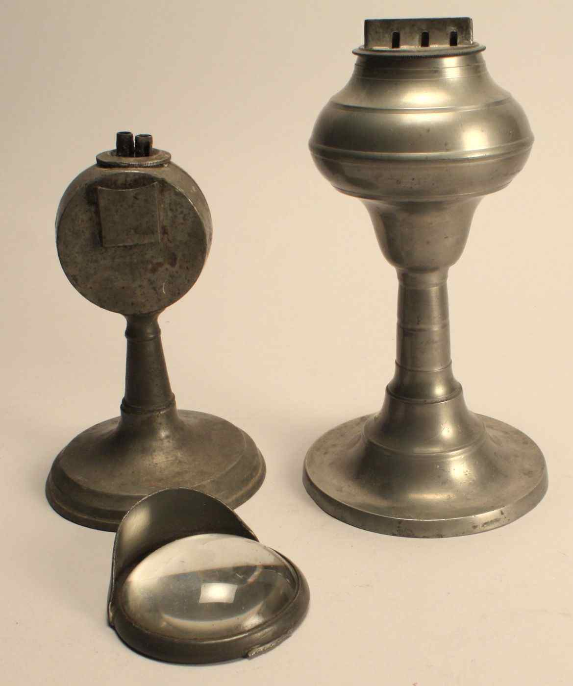 Appraisal: TWO ANTIQUE AMERICAN PEWTER OIL LAMPS th CenturyA lace maker's