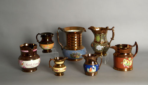 Appraisal: Seven copper luster pitchers th c tallest is h