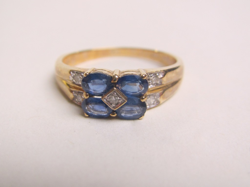 Appraisal: Nine carat gold sapphire and diamond set dress ring