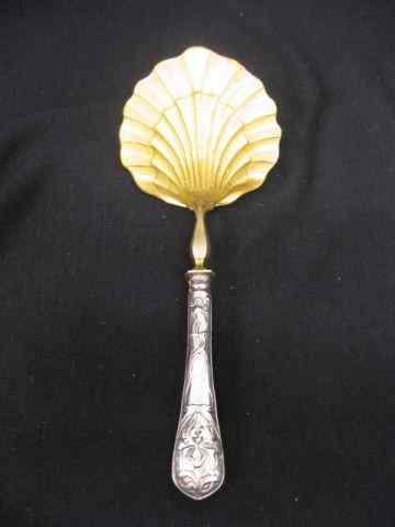 Appraisal: European Silver Serving Spoon elaborate gilt bronze shell bowl ornate