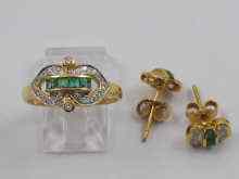 Appraisal: A yellow metal tests ct gold diamond and emerald ring