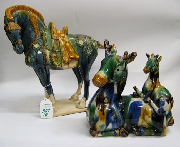 Appraisal: FOUR CHINESE POTTERY ANIMAL FIGURES colorfully painted under glaze pair