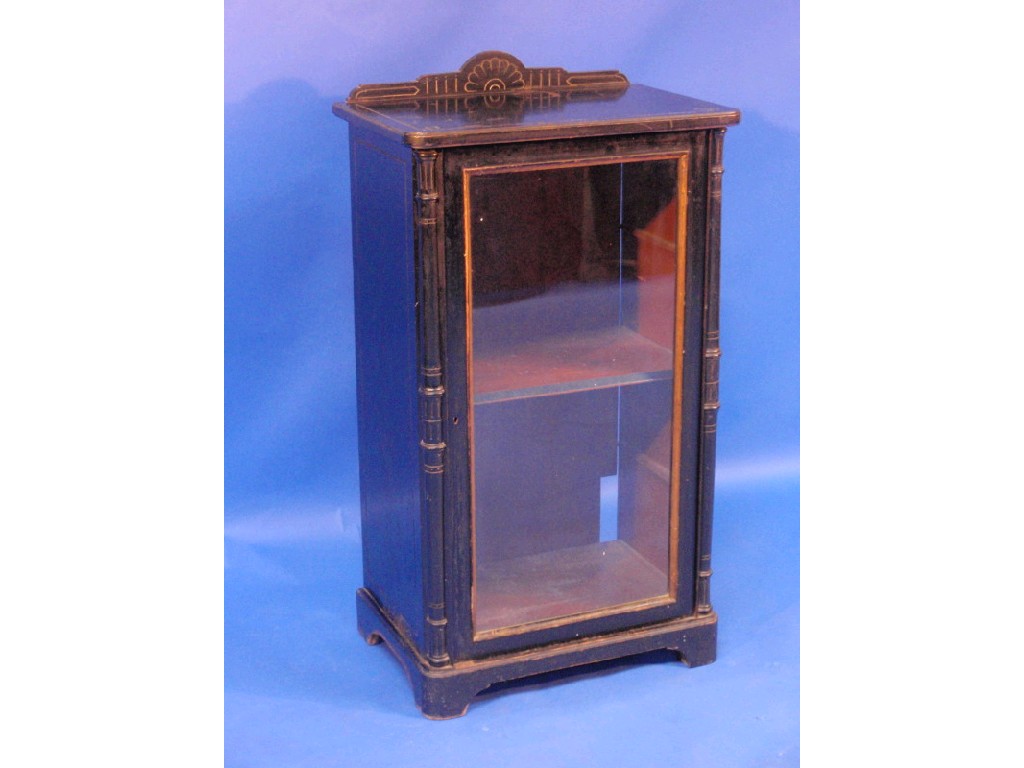 Appraisal: A Victorian ebonised glazed pedestal side cabinet