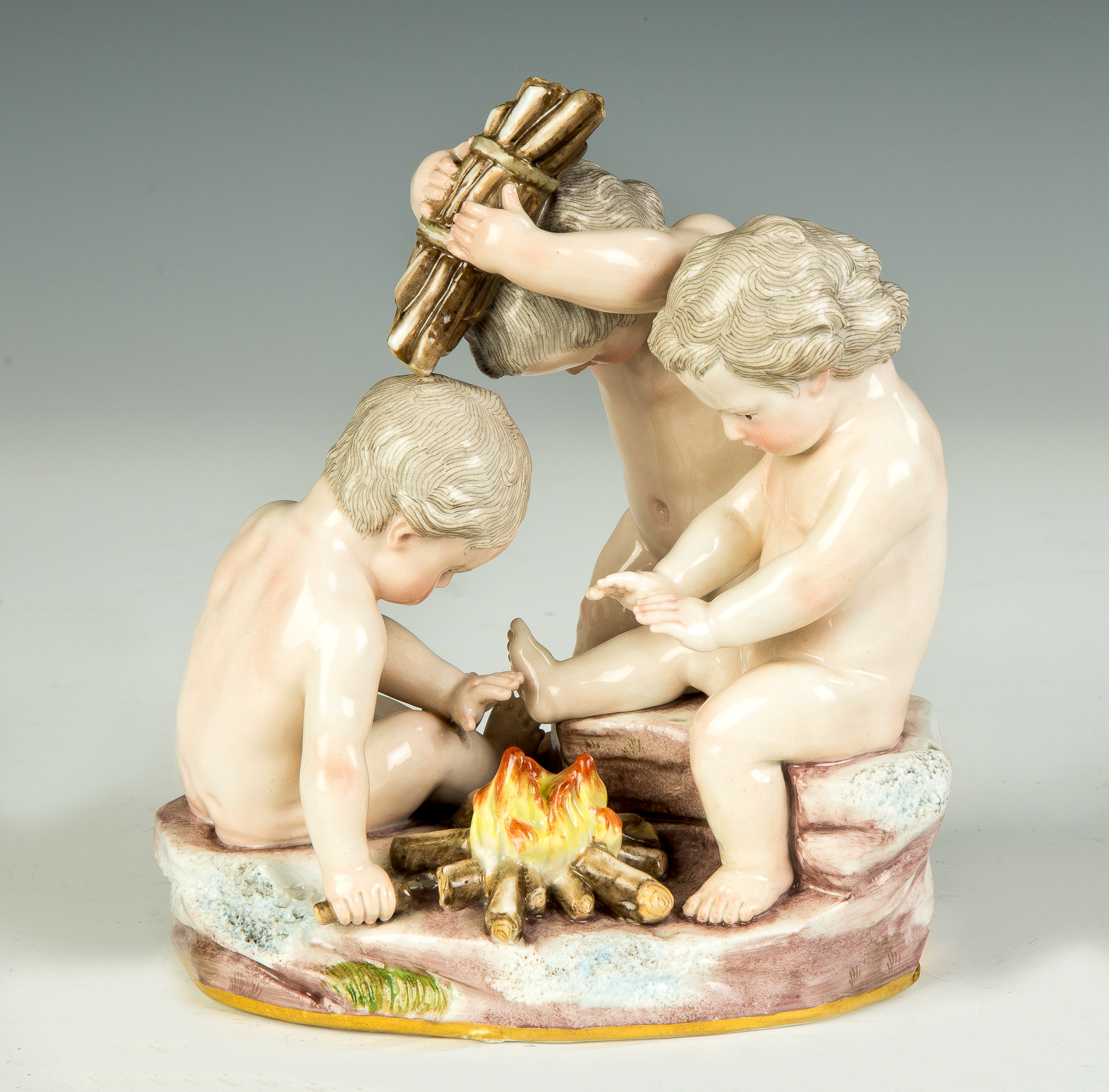 Appraisal: Meissen Figural Group Children around Campfire th century Blue crossed