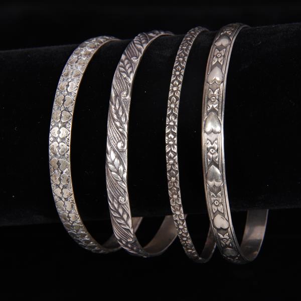 Appraisal: Four Danecraft Danish Modern sterling silver bangle bracelets with embossed