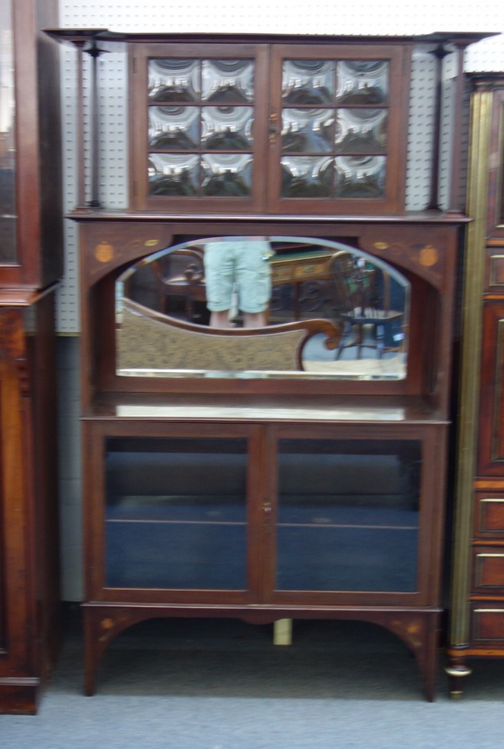 Appraisal: An Art Nouveau copper and brass inlaid mahogany side display