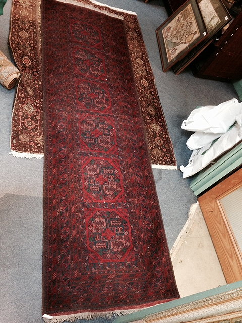 Appraisal: AN AFGHAN BOKHARA WINE GROUND RUNNER with geometric decoration within