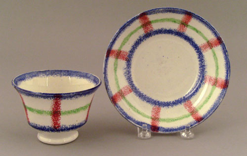 Appraisal: Red blue and green plaid spatter cup and saucer th