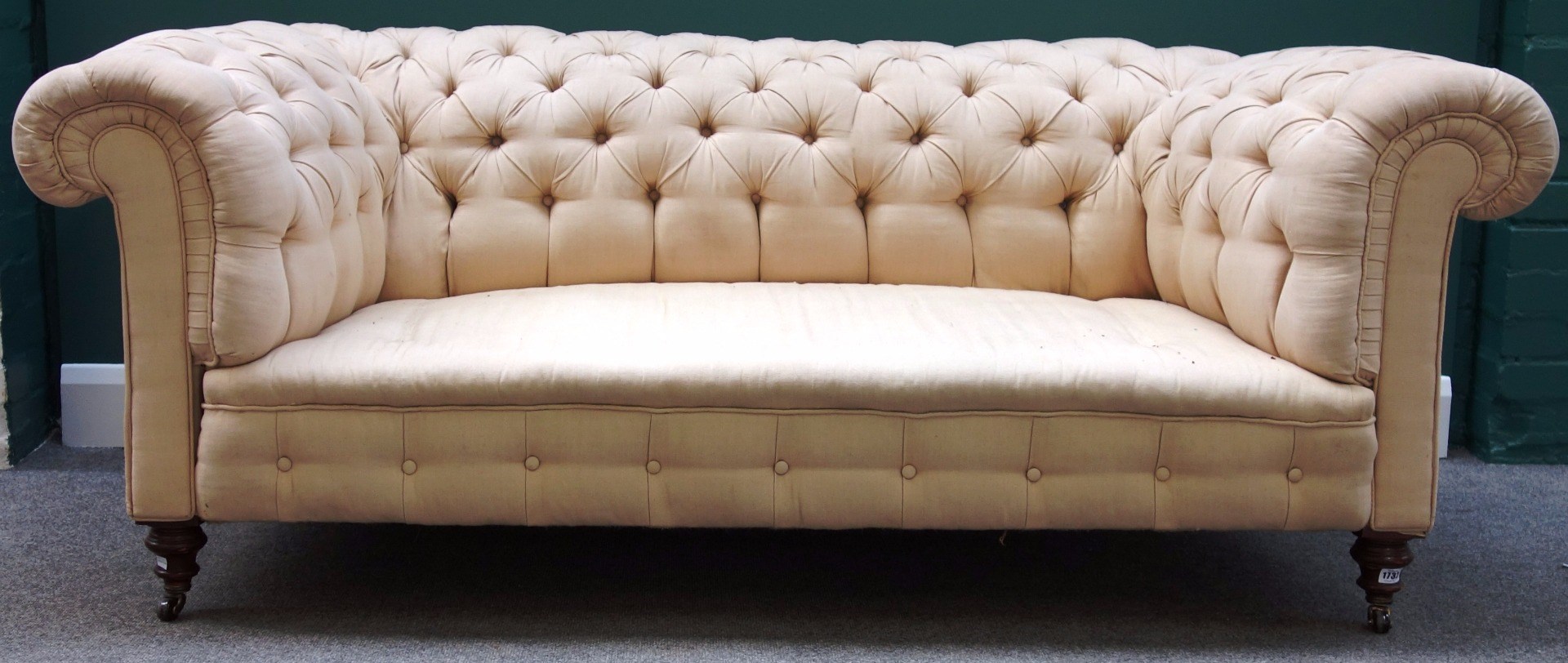 Appraisal: A Victorian button back Chesterfield sofa on turned mahogany supports