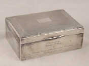 Appraisal: A sterling silver rectangular cigarette box with engine turned lid