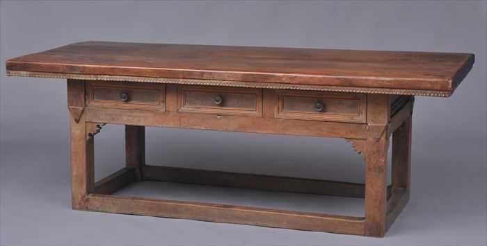 Appraisal: ITALIAN BAROQUE WALNUT CENTER TABLE The two-plank top with applied