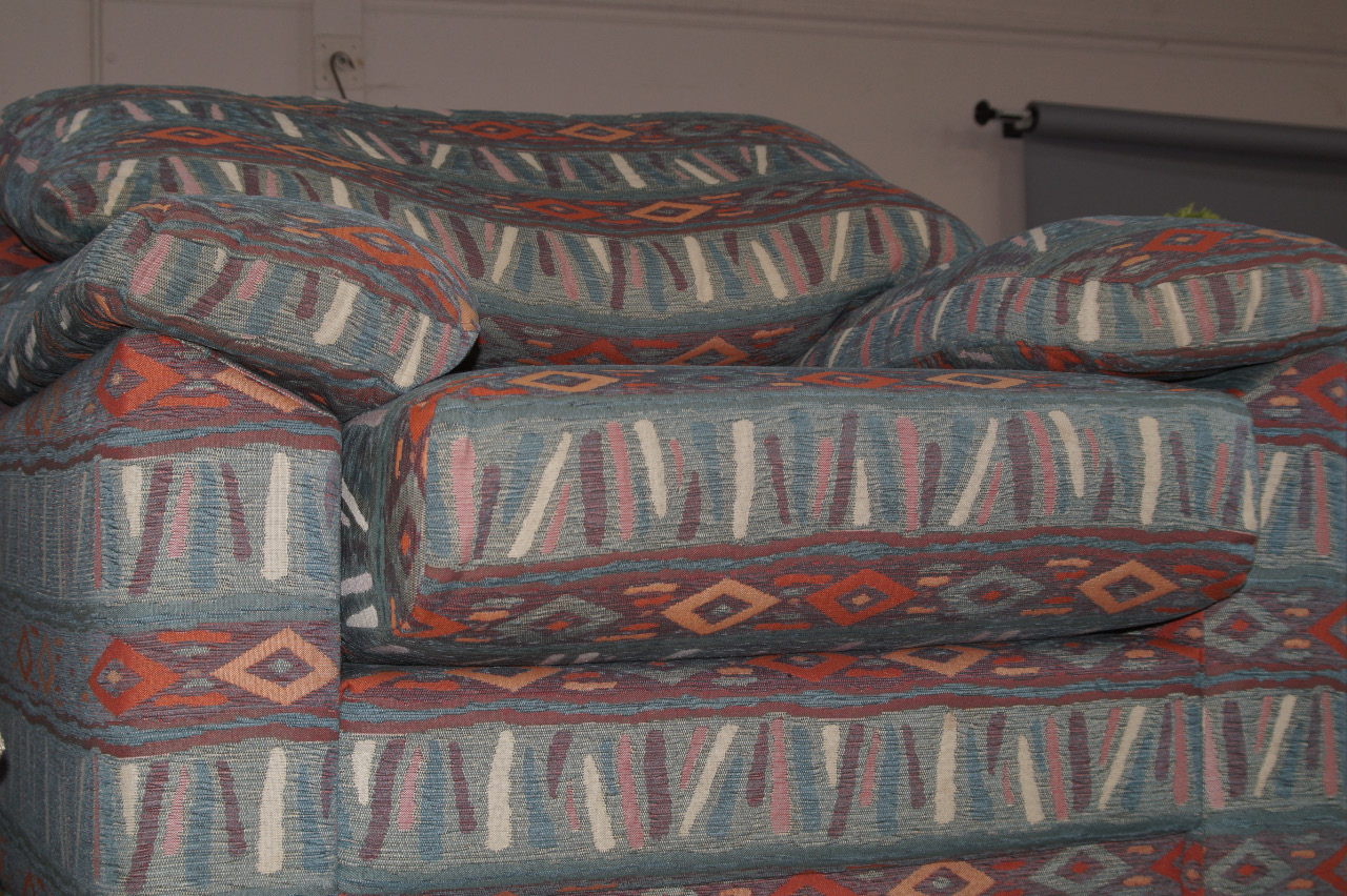 Appraisal: A Roger Lewis three seater sofa upholstered in an Aztec