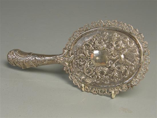 Appraisal: Victorian dressing table silver hand mirror decorated pierced borders and