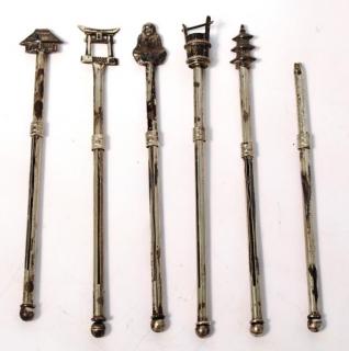 Appraisal: Sterling Japonisme Retractable Swizzle Sticks Each silver stick having handles