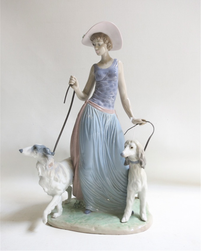 Appraisal: LLADRO PORCELAIN FIGURAL SCULPTURE Elegant Promenade sculptor Regino Torrijos issued