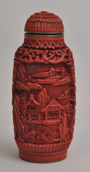 Appraisal: CHINESE CINNABAR LACQUER CYLINDRICAL SNUFF BOTTLE Relief-carved with landscape views