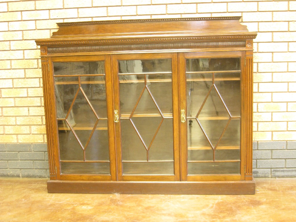 Appraisal: An Edwardian mahogany Display Cabinet with surface fret carved frieze