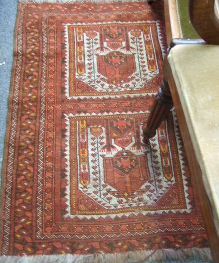 Appraisal: An Afghan double prayer rug one ivory mehrab above another