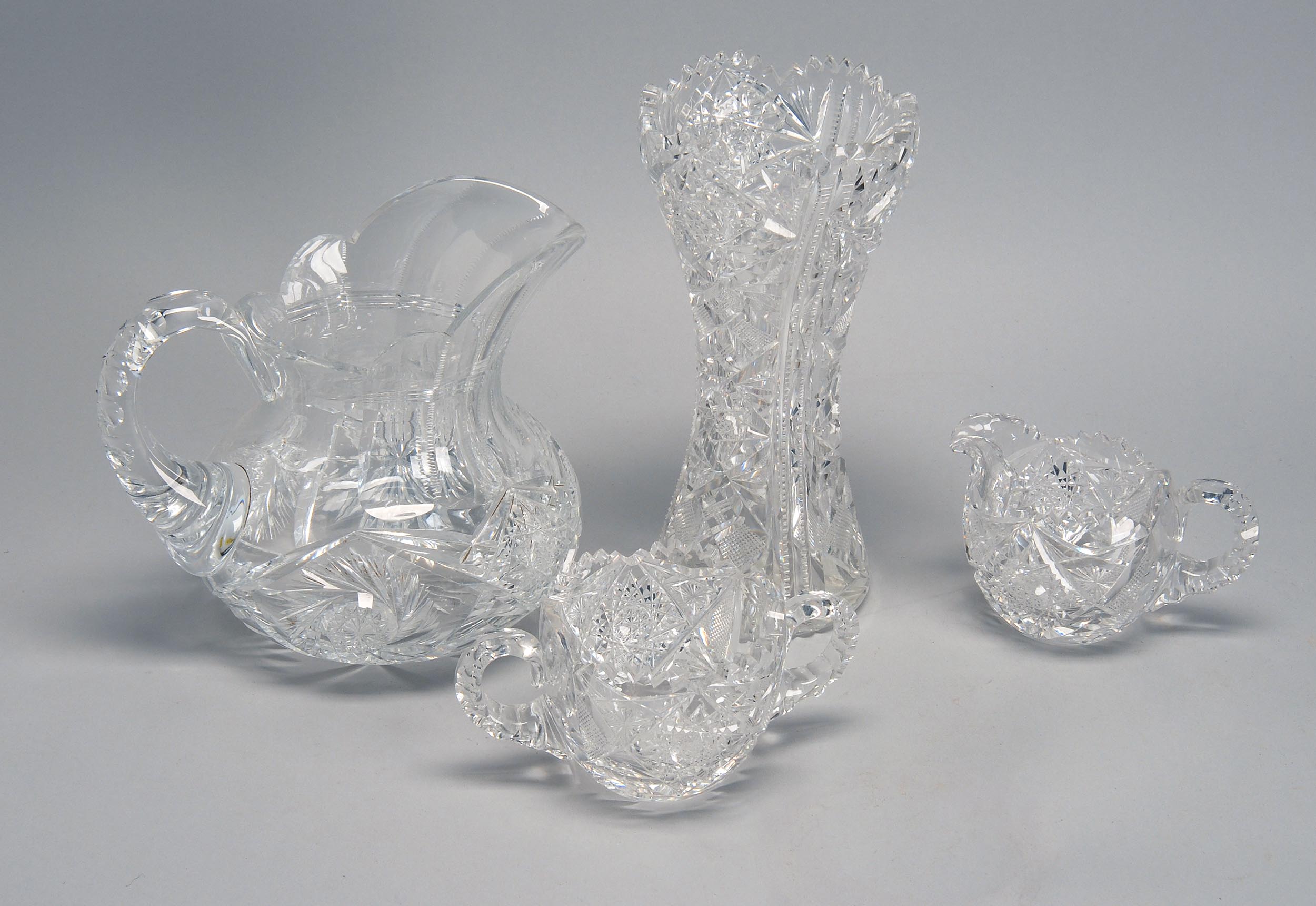 Appraisal: FOUR PIECES OF CIRCA CUT GLASS from the Bright-Cut period