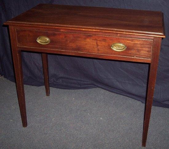 Appraisal: A George III mahogany side table the top with moulded