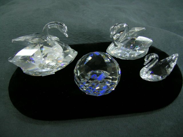 Appraisal: Four Swarovski figures including three small swans and Collector's Society