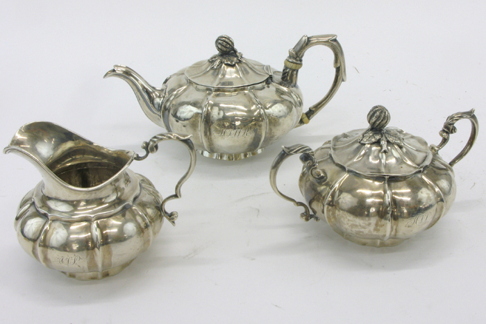 Appraisal: STERLING SILVER THREE PIECE TEA SERVICE in the melon pattern