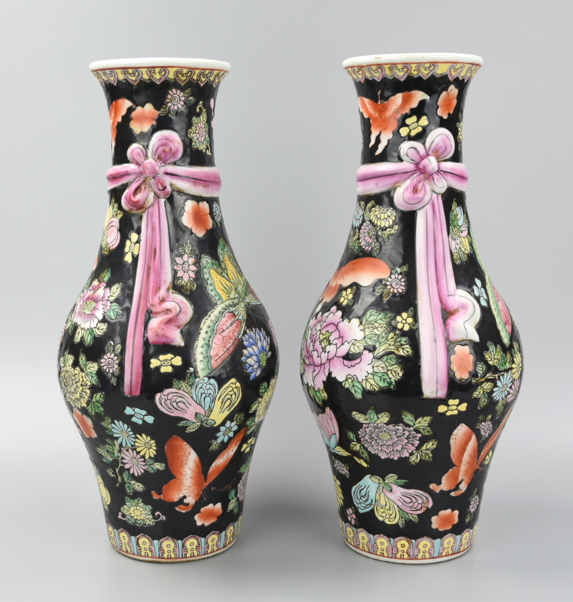 Appraisal: MATCHING PAIR OF BLACK CANTONESE BUTTERFLY VASES A pair of