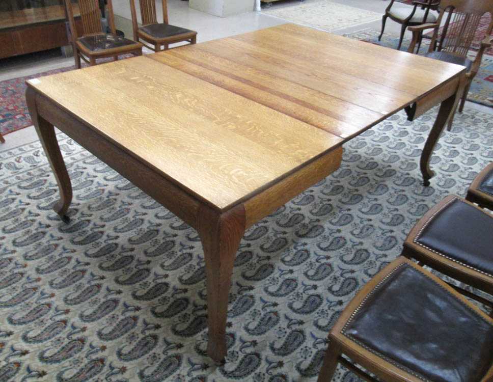 Appraisal: SQUARE OAK DINING TABLE WITH FOUR LEAVES American c standing