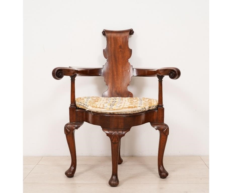 Appraisal: Unusual Georgian mahogany armchair th c with scroll carved splat