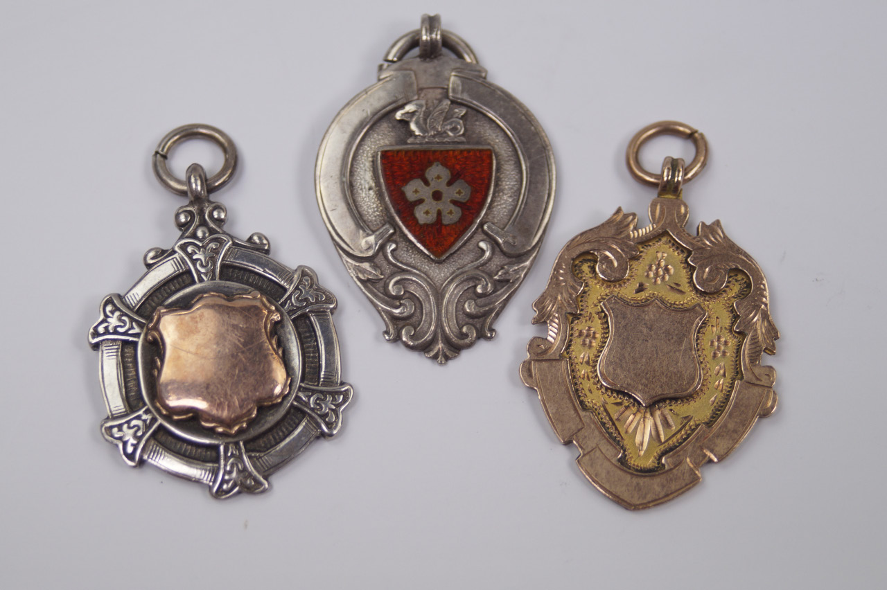 Appraisal: A ct gold Edwardian medallion g and two silver medallions