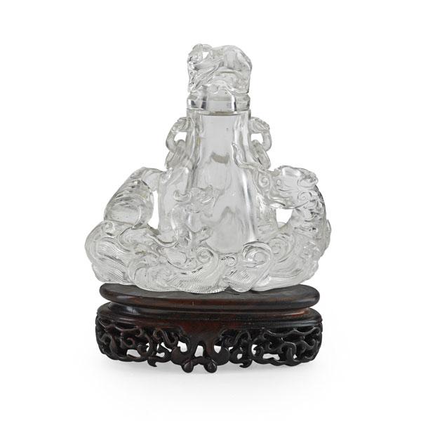 Appraisal: CHINESE ROCK CRYSTAL VASE AND COVER Ring handles extended kylon