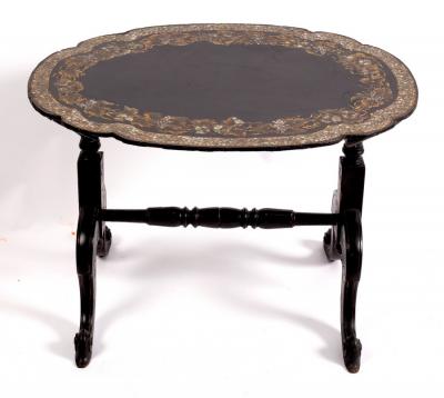 Appraisal: A black japanned trestle table circa with a shaped oval