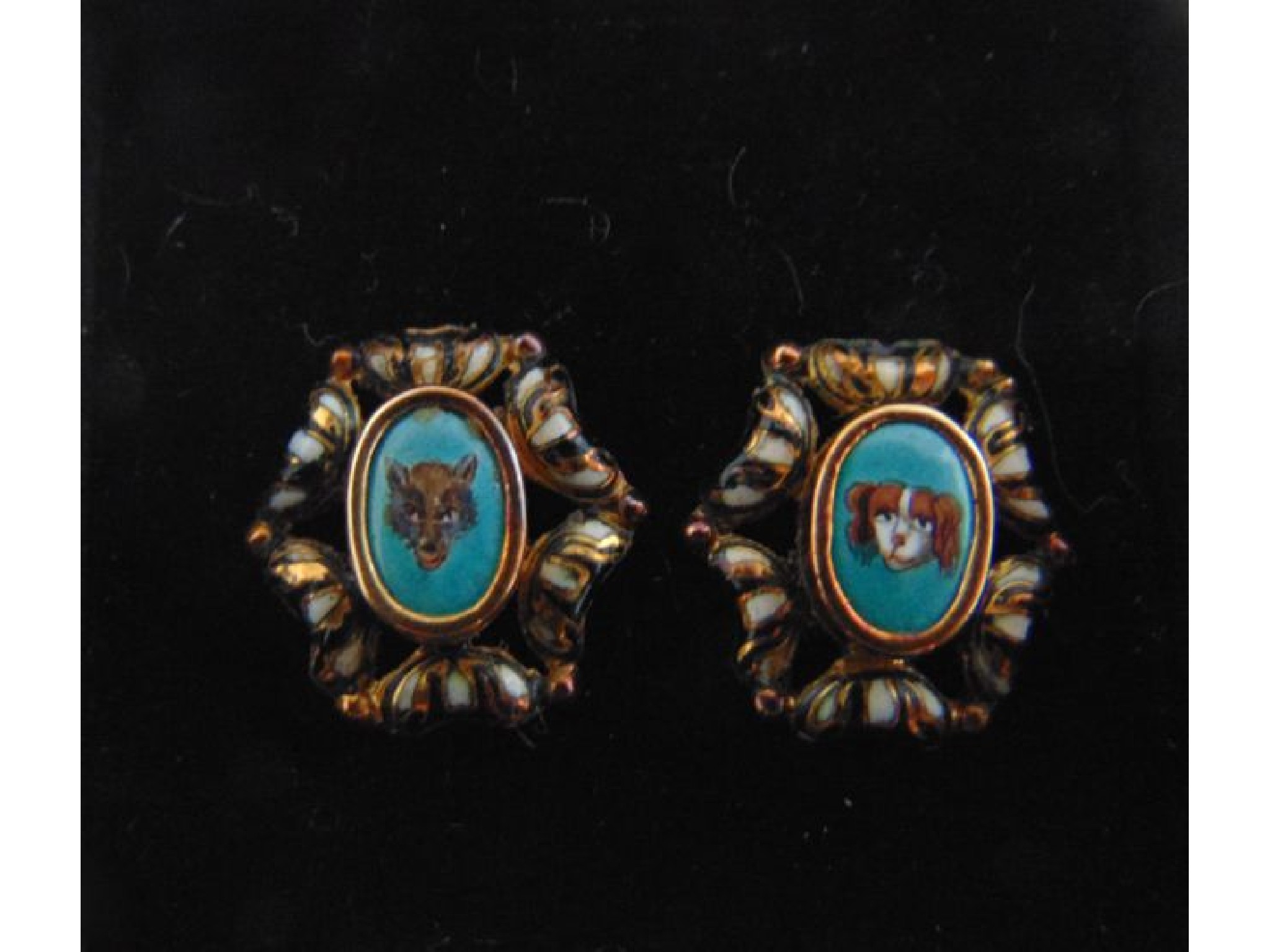 Appraisal: A pair of th century Fox Hound enamelled earrings each