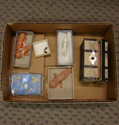 Appraisal: Lot of minis Celluloid Kewpie dolls parian doll dresser set