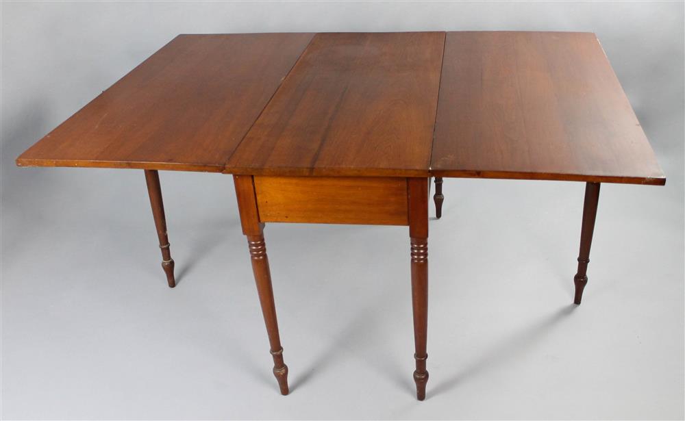 Appraisal: SHERATON STYLE CHERRYWOOD DROP LEAF TABLE having a rectangular top