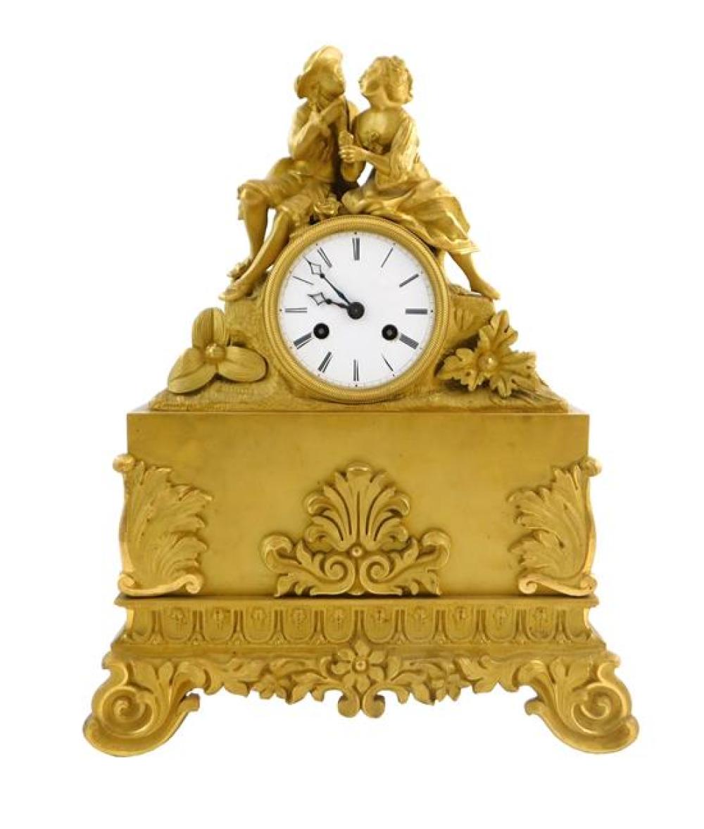 Appraisal: Gilt metal mantel clock with key and pendulum courting couple