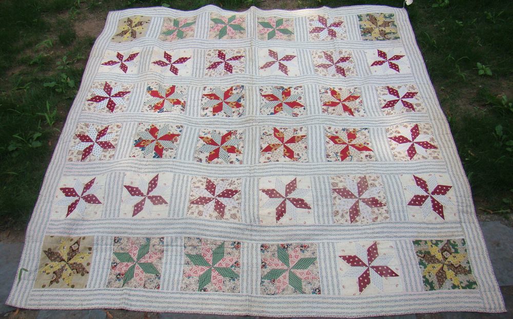 Appraisal: HAND-PIECED QUILT Late th Early th CenturyIn block and four-petal