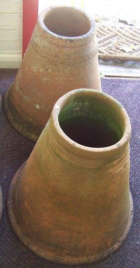 Appraisal: A pair of terracotta rhubarb forcers cm high