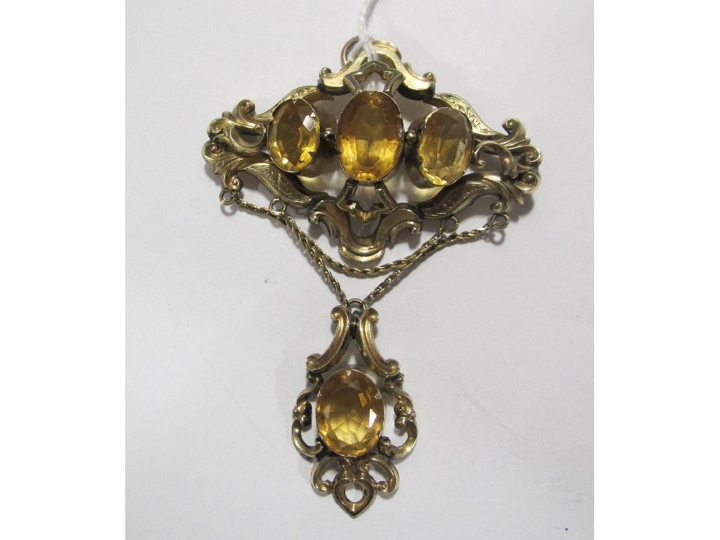 Appraisal: Victorian yellow metal scroll brooch with citrine insets