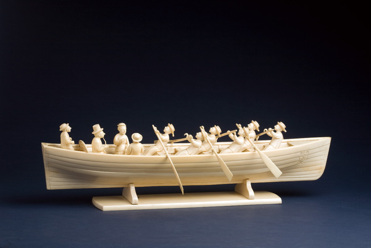 Appraisal: CARVED BONE MODEL OF A LONGBOAT WITH OARSMAN AND PASSENGERS