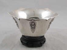 Appraisal: An oriental silver bowl on wooden stand circa approx x