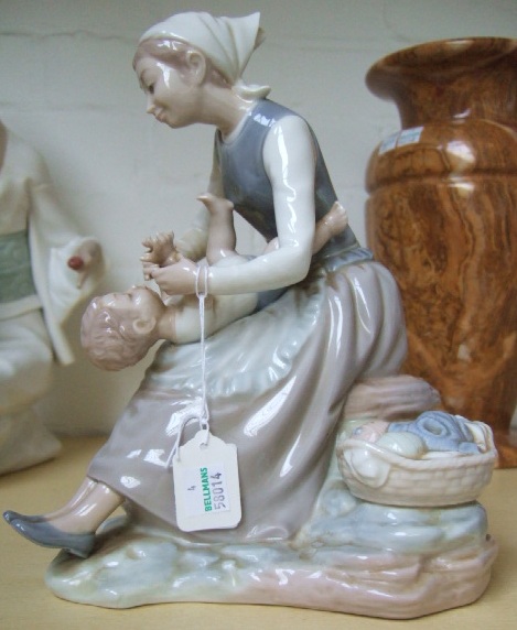 Appraisal: A Nao figure of group of a mother and baby