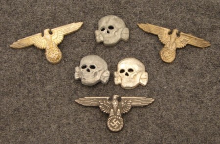 Appraisal: Lot of German SS metal cap devices both eagles and