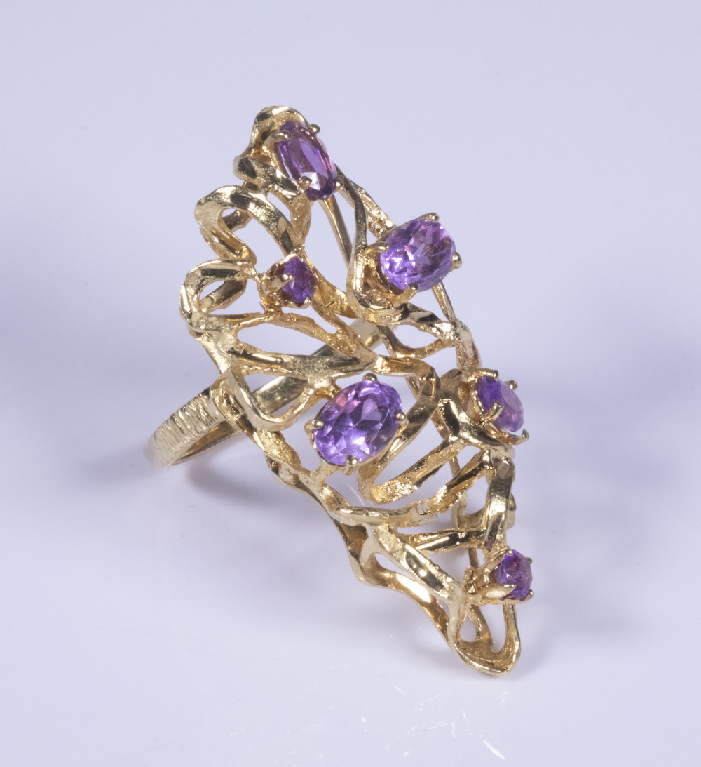 Appraisal: LADIES K GOLD AND AMETHYST RING Free form design set