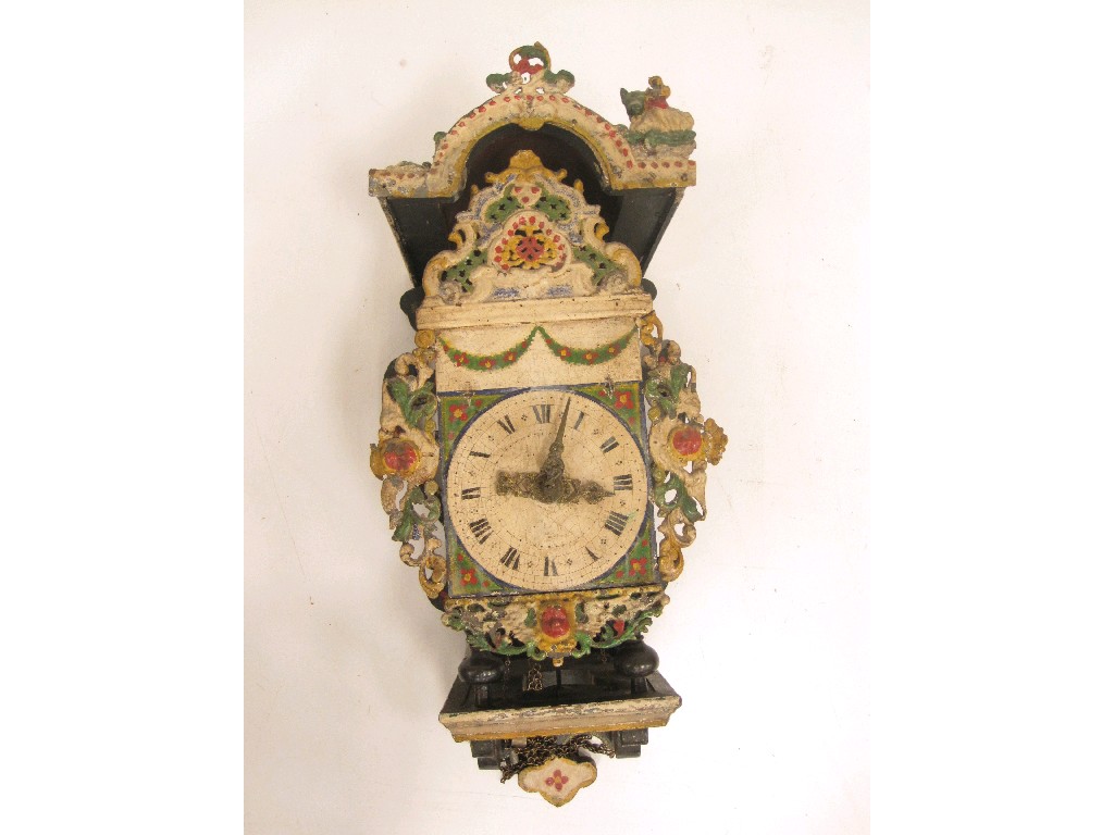 Appraisal: A Dutch Wall Clock the metal arched face having pierced