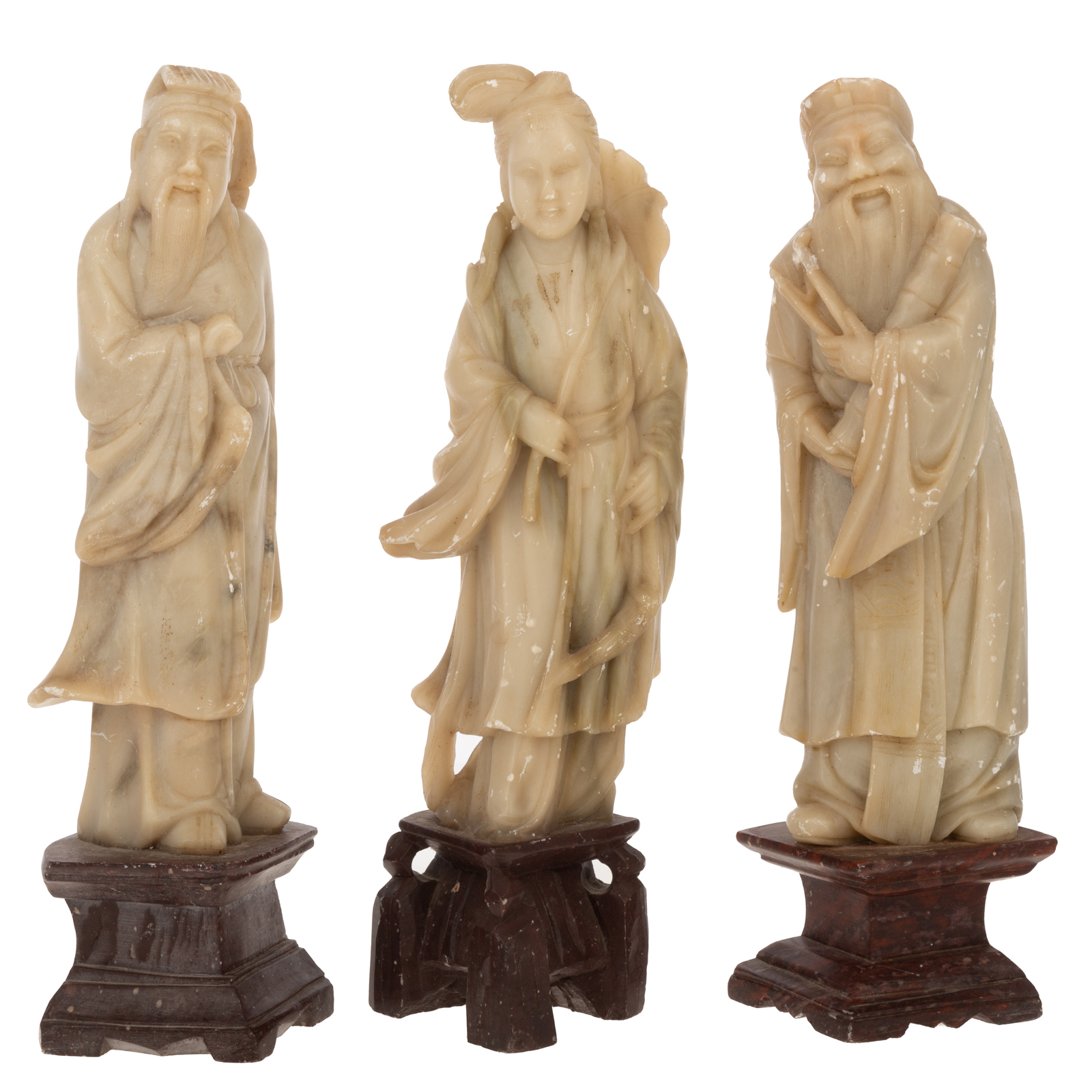 Appraisal: THREE CHINESE CARVED SOAPSTONE IMMORTALS Carved figures on carved soapstone