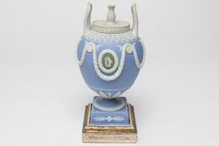 Appraisal: Wedgwood Jasperware Neoclassical Urn Tri Wedgwood Jasperware bisque pottery Neoclassical-style